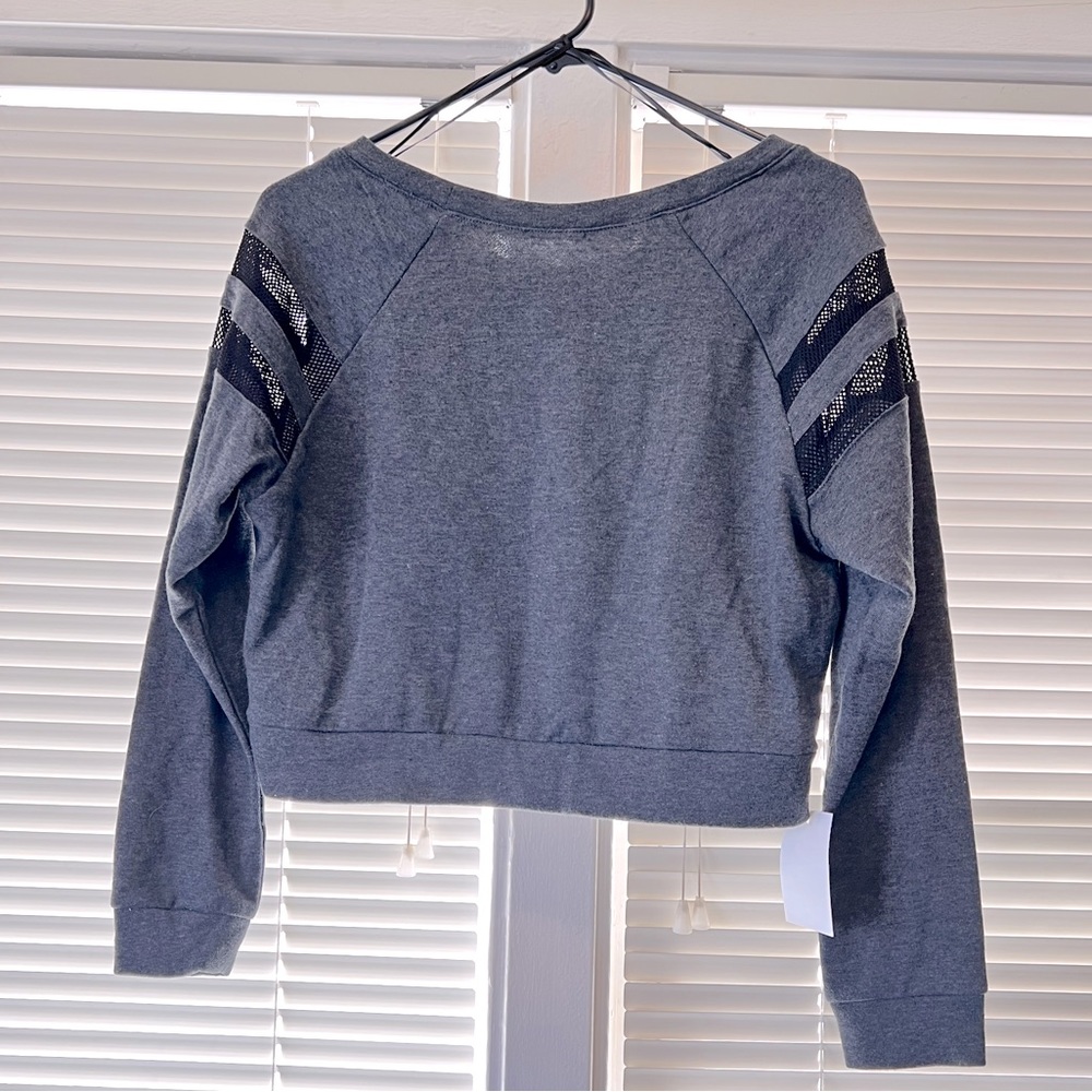 Crop top with mesh accents.
